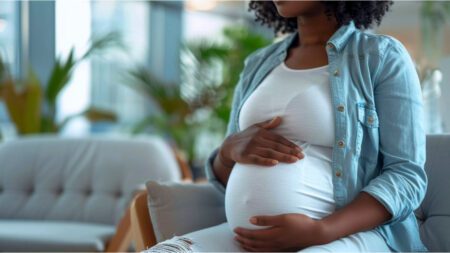 Pregnant African woman practicing prenatal self-care