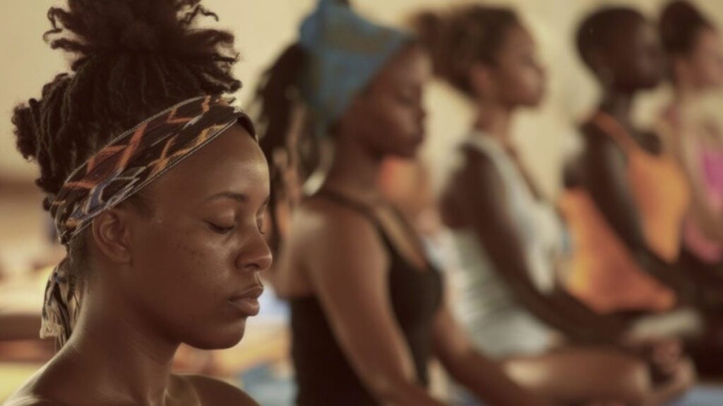 Group practicing yoga for heart health in peaceful setting