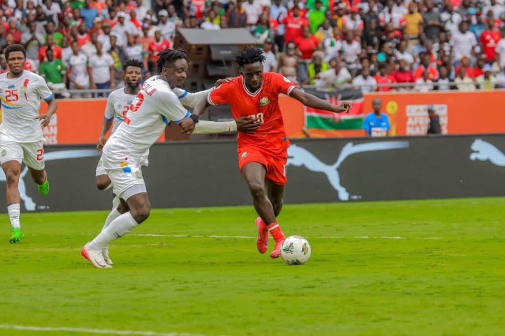 Harambee Stars players celebrate during CHAN 2024 group stage match at Kasarani Stadium.