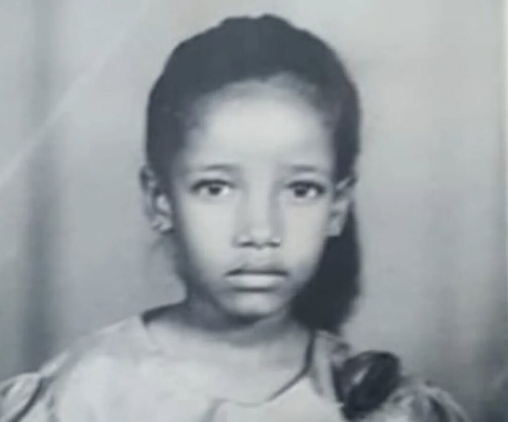 A childhood photo of a young Anita Nderu, shared alongside her reflection on surviving the 2008 Eldoret violence and parallels with current protests.