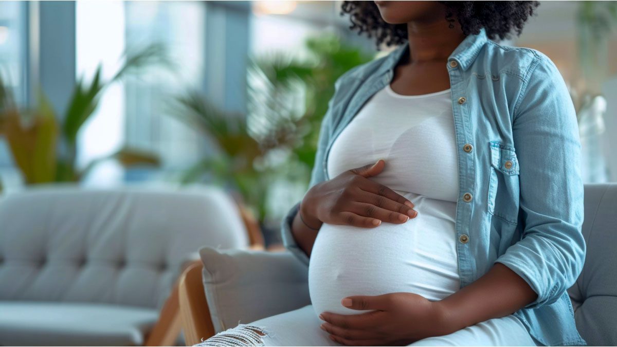Pregnant African woman practicing prenatal self-care