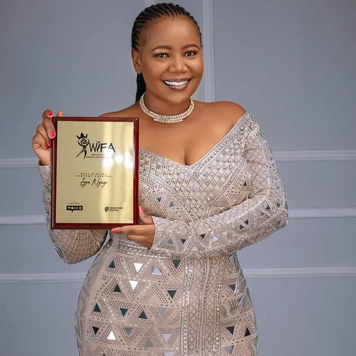 Lynn Ngugi, holding her Best Digital Content Creator award at the Women in Film Awards (WIFA)